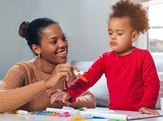 Happy family. Mother and daughter together paint.