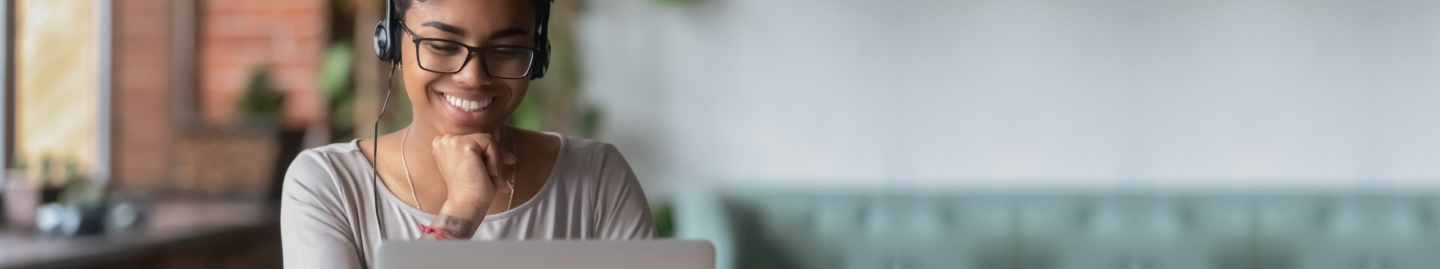 Smiling woman at computer