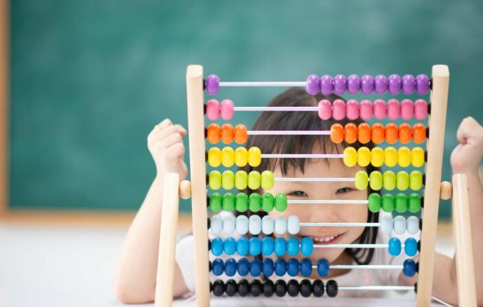 Students boy and girl leaning math in the class room Montessori